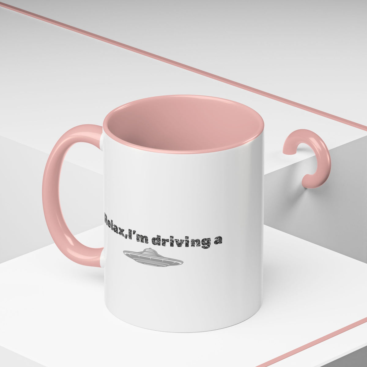 Ceramic coffee mug with UFO accent and “Relax, I’m Driving” text in black and white, 11 oz size, by Printify.