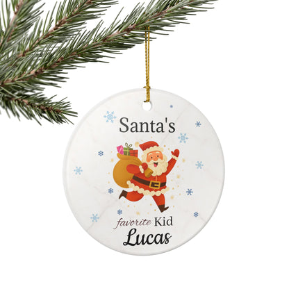 Personalized Santa's Favorite Kid ceramic ornament featuring the name Lucas, with festive holiday design for Christmas decorations.