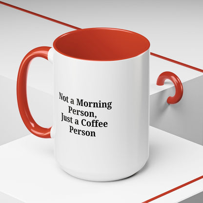 Ceramic coffee mug with the phrase "Not a Morning Person, Just a Coffee Person" printed on it, perfect for morning beverage enjoyment.