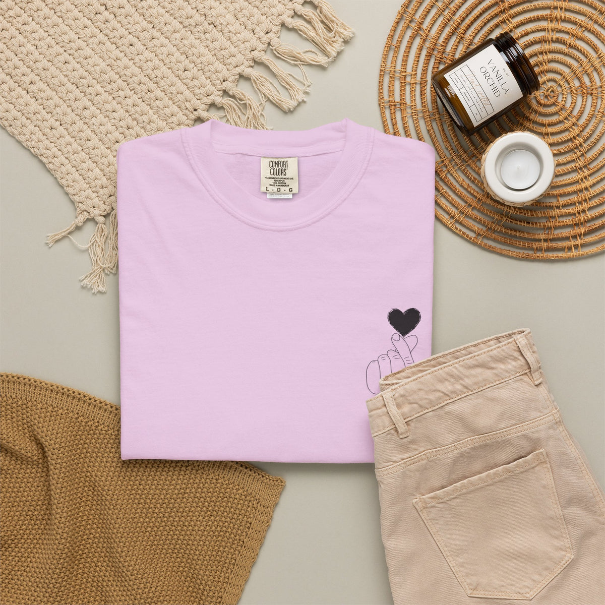 Minimal black heart graphic T-shirt, Printify finger heart design on a casual black tee, perfect for stylish everyday wear.