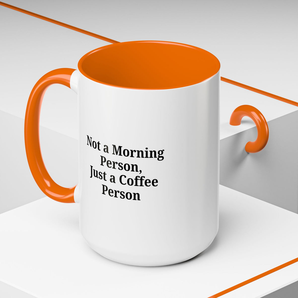 Ceramic coffee mug with the phrase "Not a Morning Person, Just a Coffee Person" in black text on a white background.