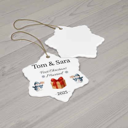 Personalized ceramic ornament with "Tom & Sara First Christmas Married 2025" engraving, featuring festive holiday design.