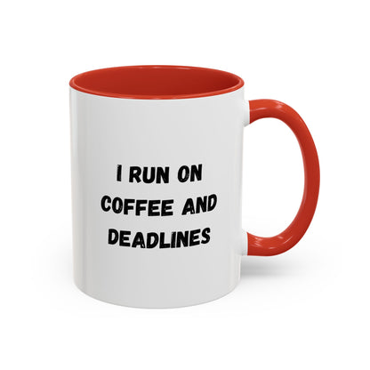 White ceramic coffee mug with black text reading "I run on coffee and deadlines" for motivational coffee drinkers.