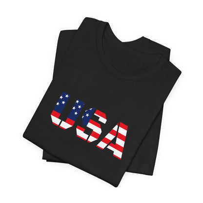 USA flag text patriotic T-shirt by Printify, featuring bold red, white, and blue design for Fourth of July celebrations.