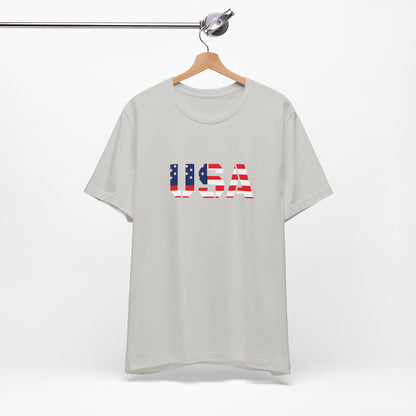 USA Flag Text T-Shirt by Printify, patriotic Fourth of July tee with bold flag and text design on comfortable fabric.