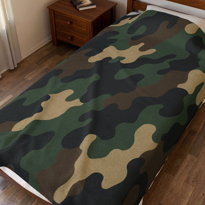 Camouflage velveteen plush blanket featuring all-over camo print, ideal for camping, hunting, and cozy home use by Printify.