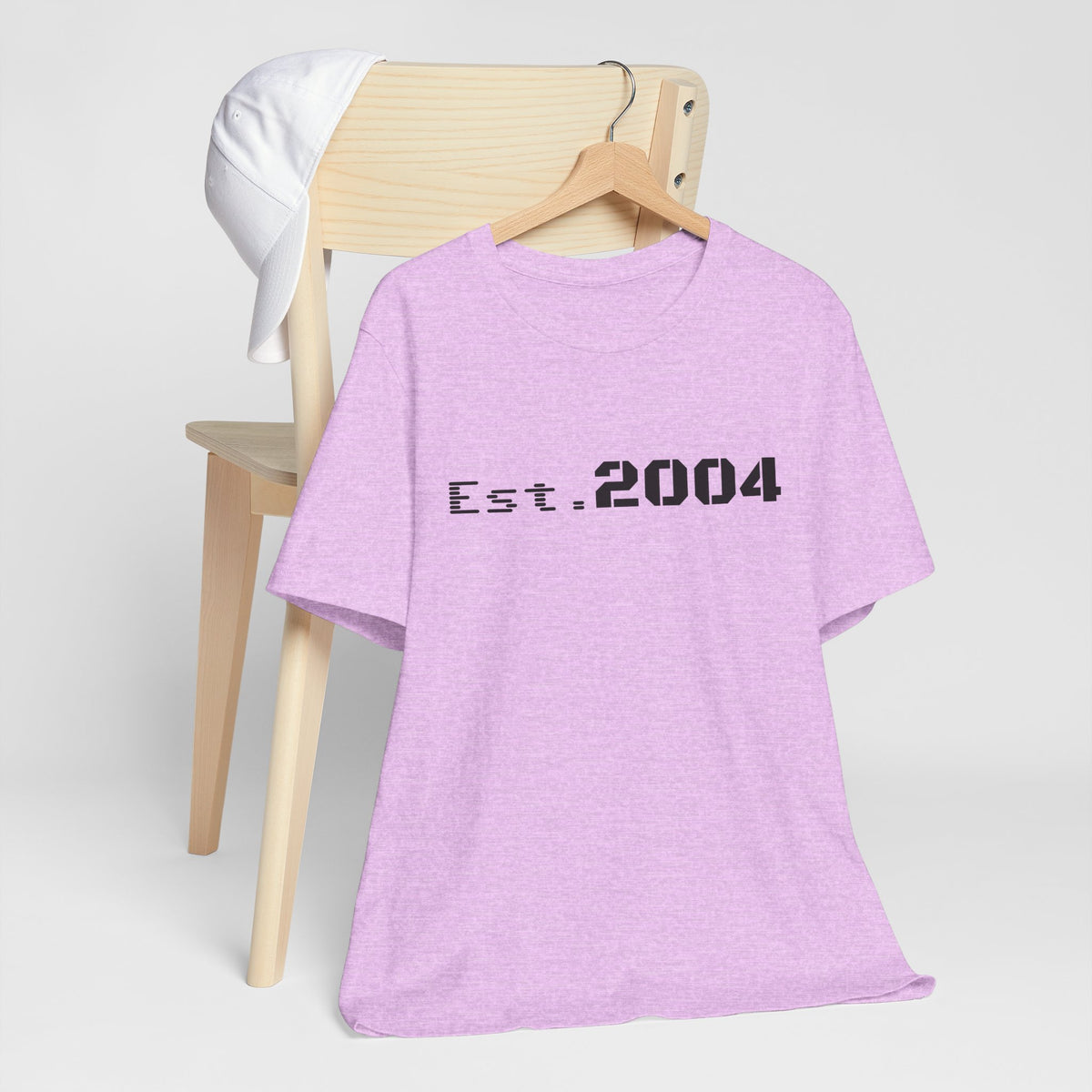 Minimal vintage Est. 2004 T-shirt by Printify featuring a classic birth year design on soft cotton fabric.