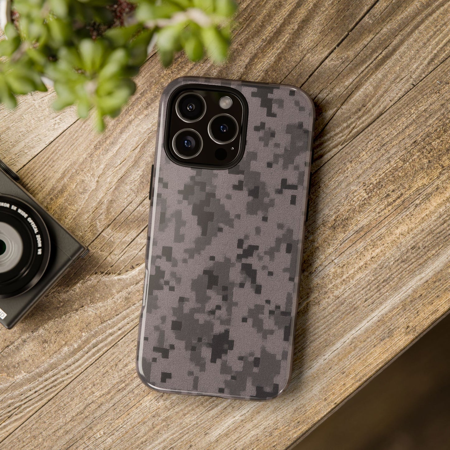 Gray digital camouflage phone case by Printify, tough protective cover fitting smartphones securely with a rugged camo design.
