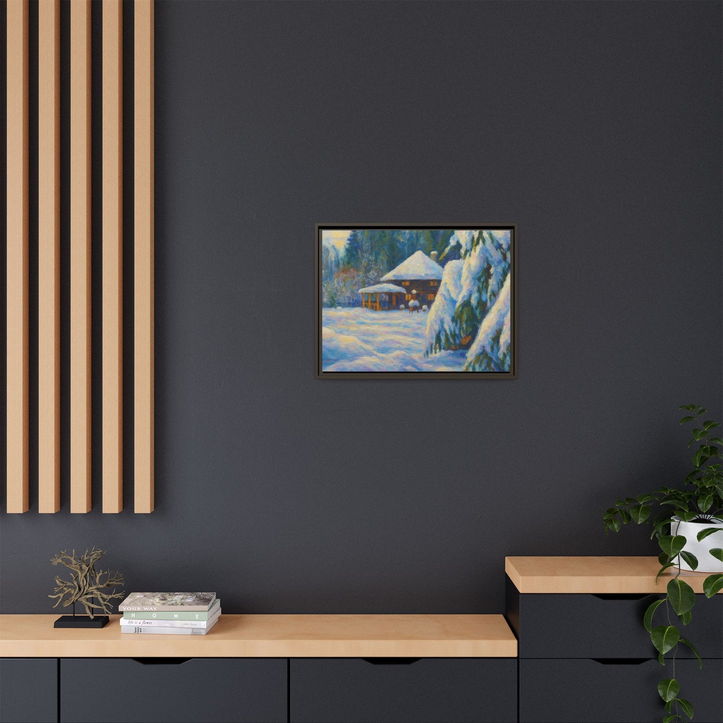 Framed matte canvas wall art of a snowy cabin winter landscape, depicting a cozy cabin surrounded by snow-covered trees.