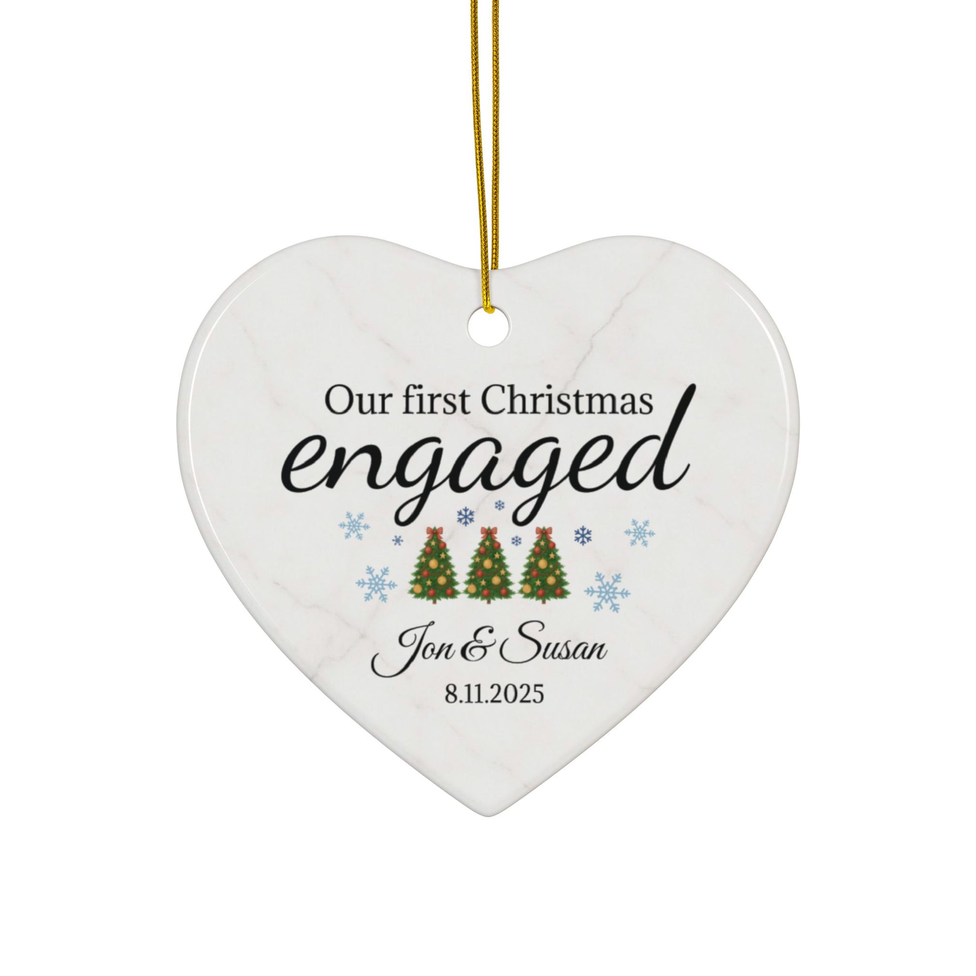 Ceramic "Our First Christmas Engaged" heart ornament by Printify, festive holiday decoration with engraved sentiment.