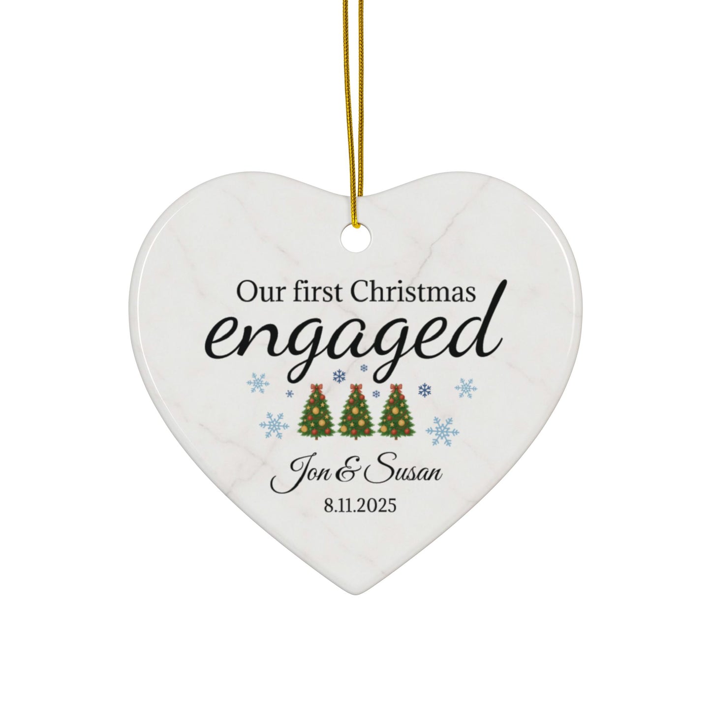 Ceramic "Our First Christmas Engaged" heart ornament with festive holiday design, perfect for celebrating a couple's engagement.