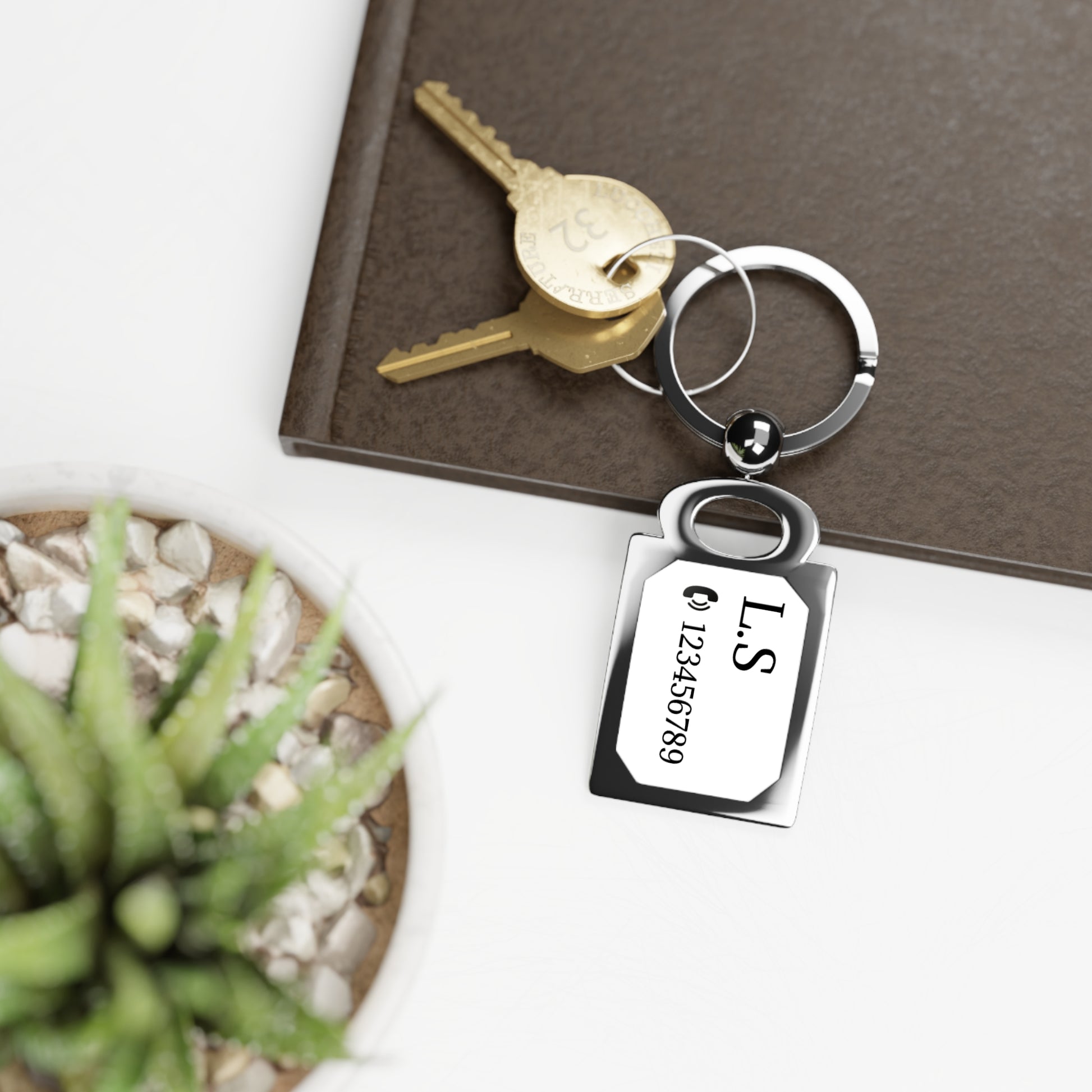 Engraved rectangle photo keyring accessory with personalized photo display, featuring a metal keyring and custom engraved design.