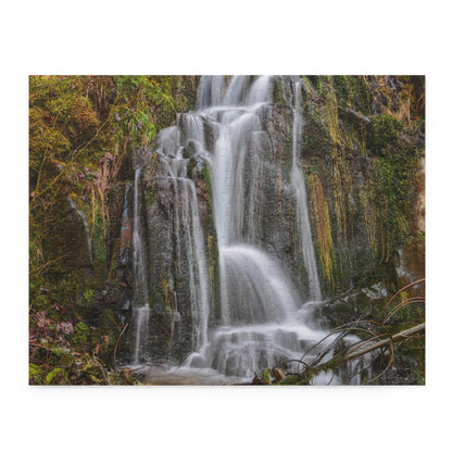 Colorful Mossy Waterfall puzzle by Printify featuring detailed waterfall and lush mossy scenery, ready for assembly.