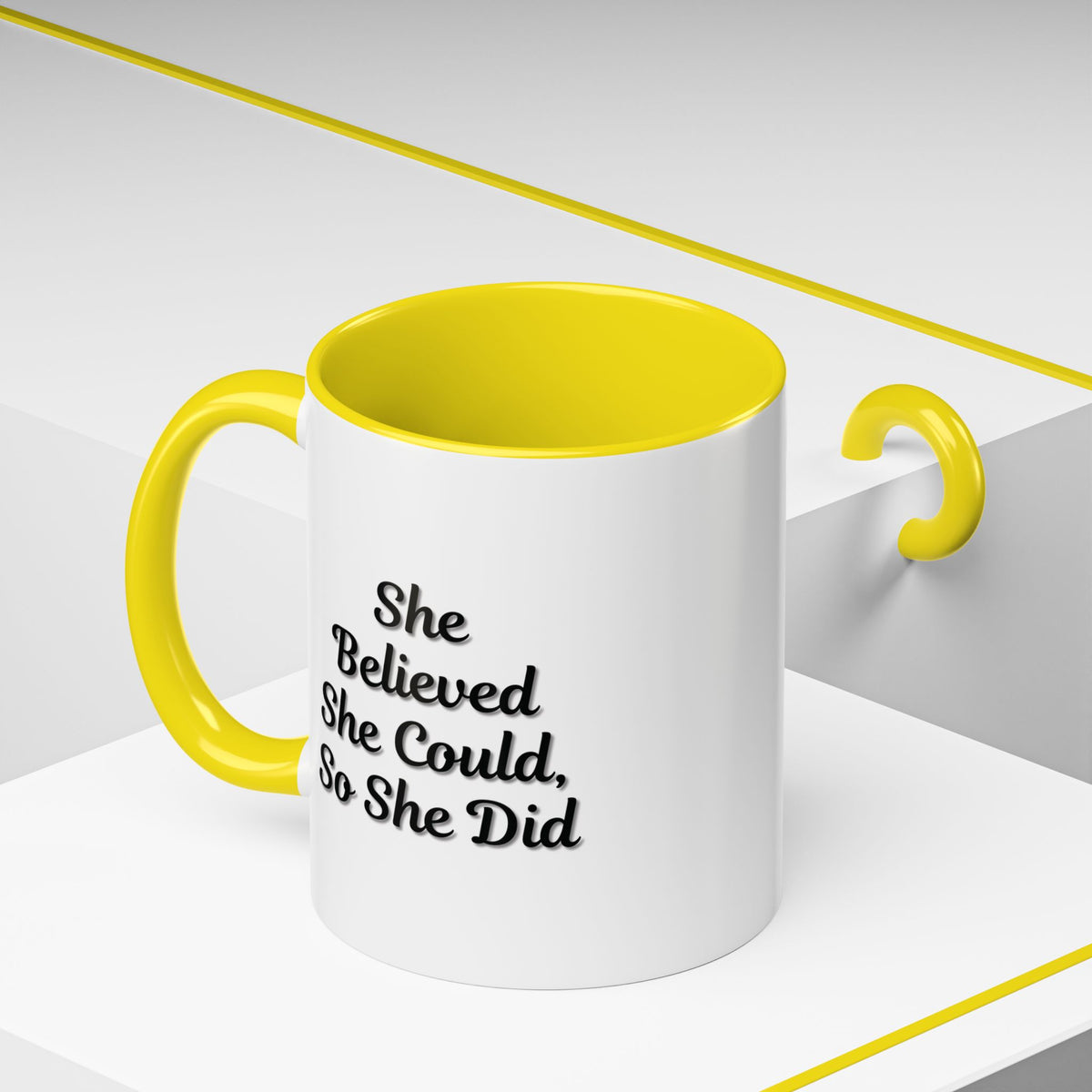 Printify motivational coffee mug with the quote "She Believed She Could, So She Did" featuring a ceramic mug with black lettering.