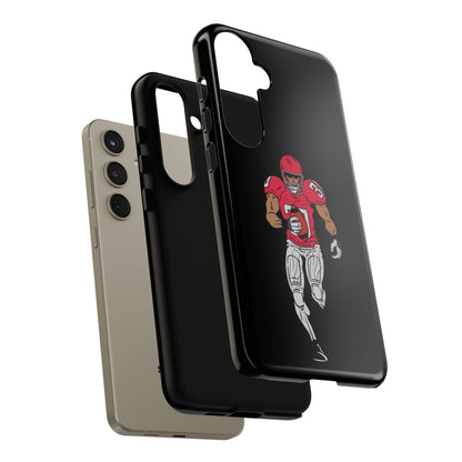 Black football player tough phone case for iPhone, protective sports design by Printify, featuring a dynamic athletic figure.