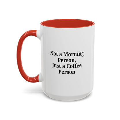 Ceramic coffee mug with "Not a Morning Person, Just a Coffee Person" print, perfect for morning beverage enjoyment.
