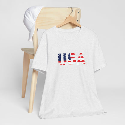 Red, white, and blue USA flag text T-shirt by Printify featuring patriotic Fourth of July design, casual graphic tee for Independence Day.