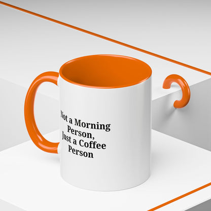 Ceramic coffee mug with the phrase "Not a Morning Person, Just a Coffee Person" printed on it, ideal for morning beverage lovers.
