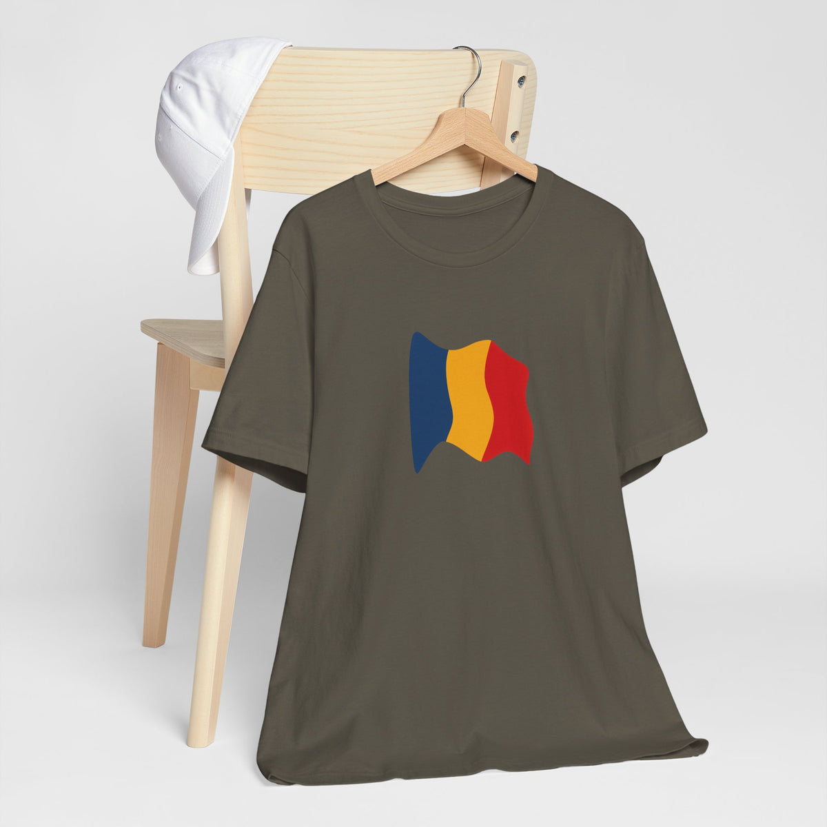 Romania flag T-shirt by Printify featuring a minimal waving tricolor design on a casual cotton tee.