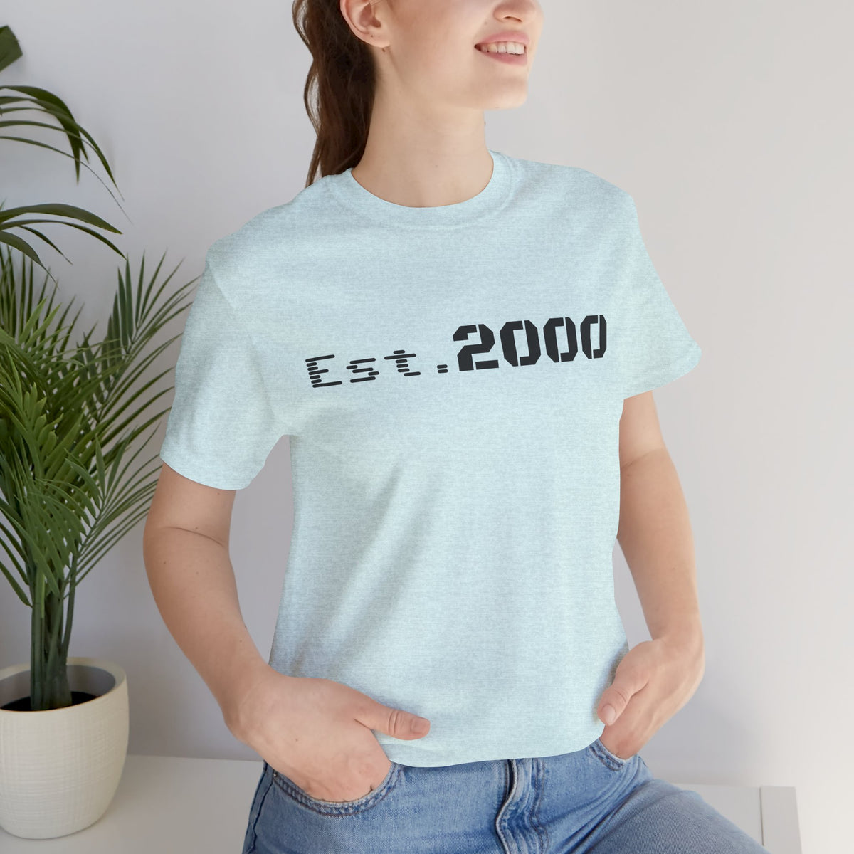 Retro pixel design T-shirt with "Born in 2000" text, printed by Printify, celebrating the 2000 birth year.