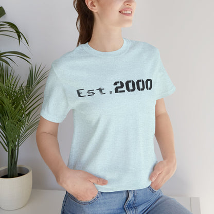 Retro pixel design T-shirt with "Born in 2000" text, printed by Printify, celebrating the 2000 birth year.