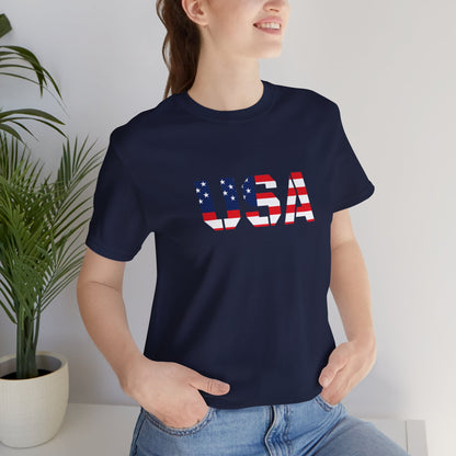 USA flag text T-shirt by Printify featuring patriotic design, perfect for Fourth of July celebrations, with a bold American flag graphic.