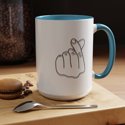 Minimal Korean finger heart accent coffee mug by Printify, 11oz or 15oz, featuring simple finger heart design on white ceramic mug.