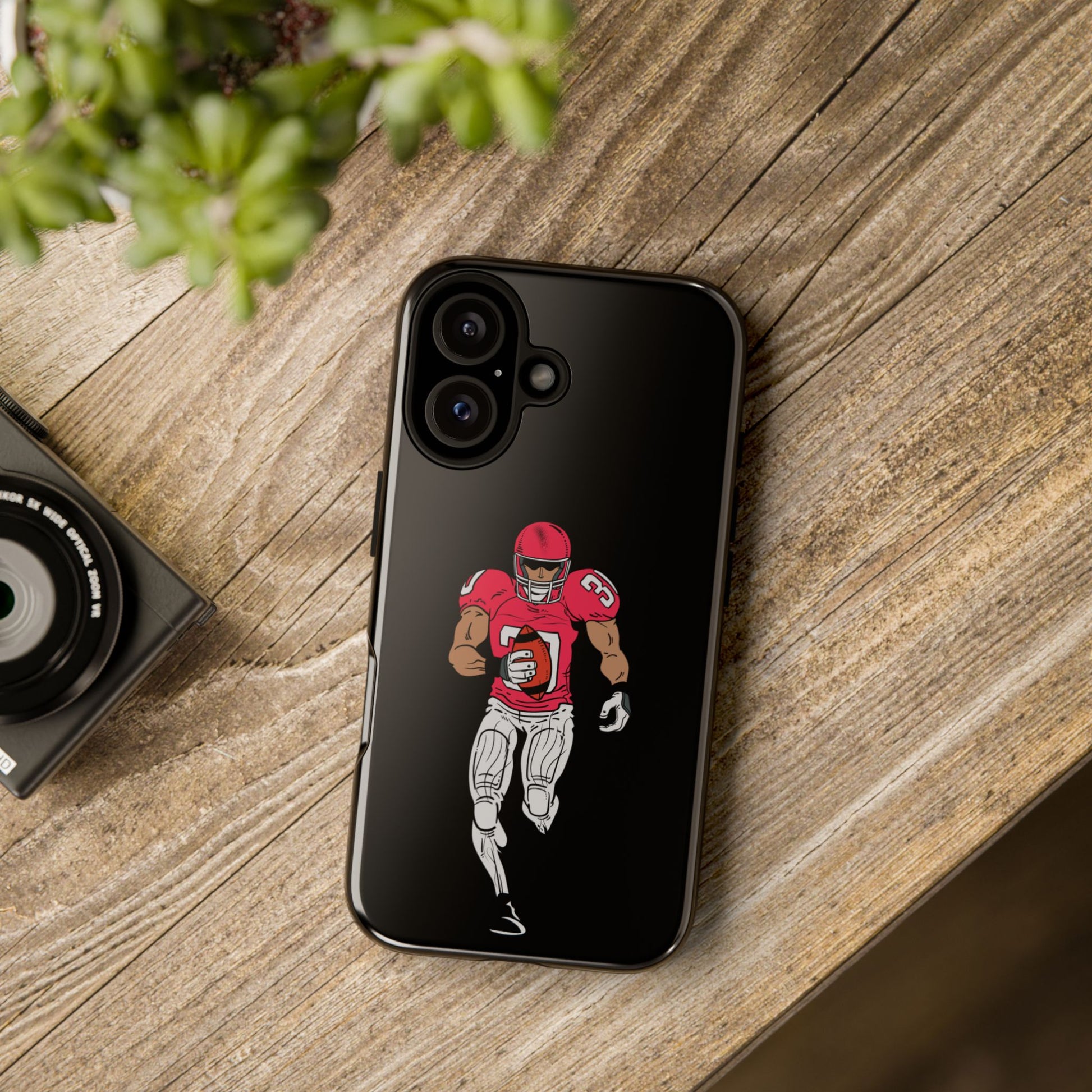 Black football player tough phone case for iPhone by Printify, featuring sports-themed design and protective build.