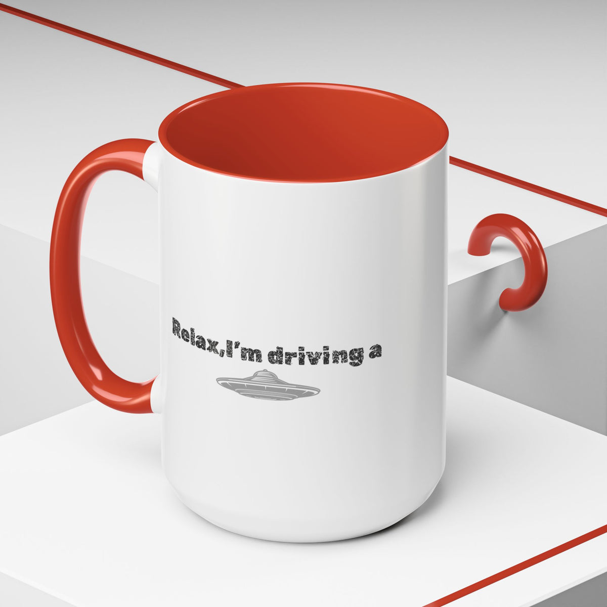 Ceramic coffee mug with "Relax, I’m Driving" UFO accent design, available in 11 or 15 oz, by Printify.