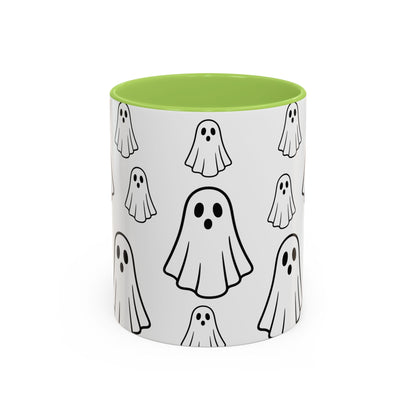 White ceramic coffee mug with ghost pattern, 11oz, featuring cute Halloween-themed ghost design, ideal for spooky season drinks.