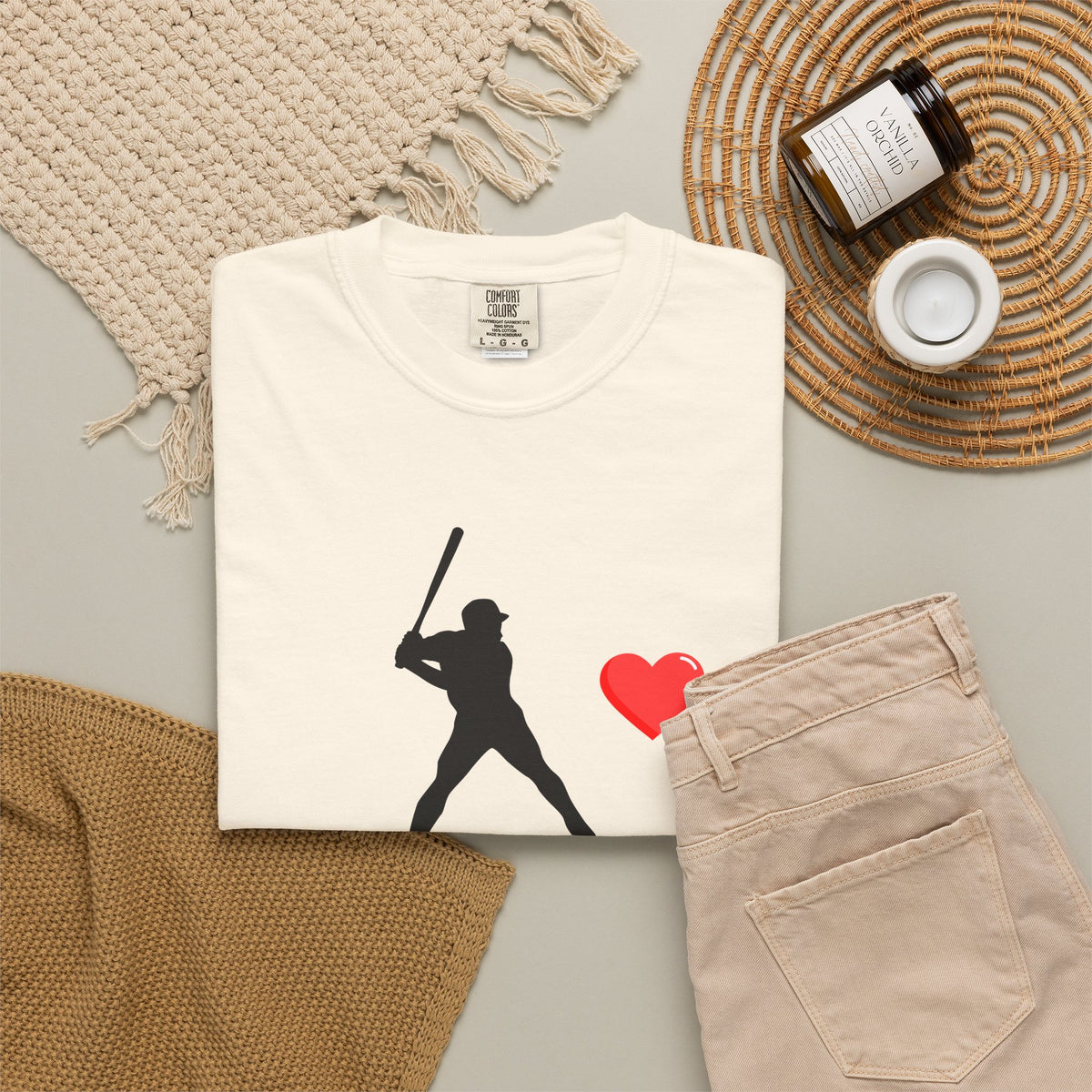 White baseball batter heart T-shirt by Printify featuring a graphic of a batter swinging a bat on the front.