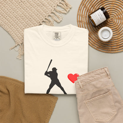 White baseball batter heart T-shirt by Printify featuring a graphic of a batter swinging a bat on the front.