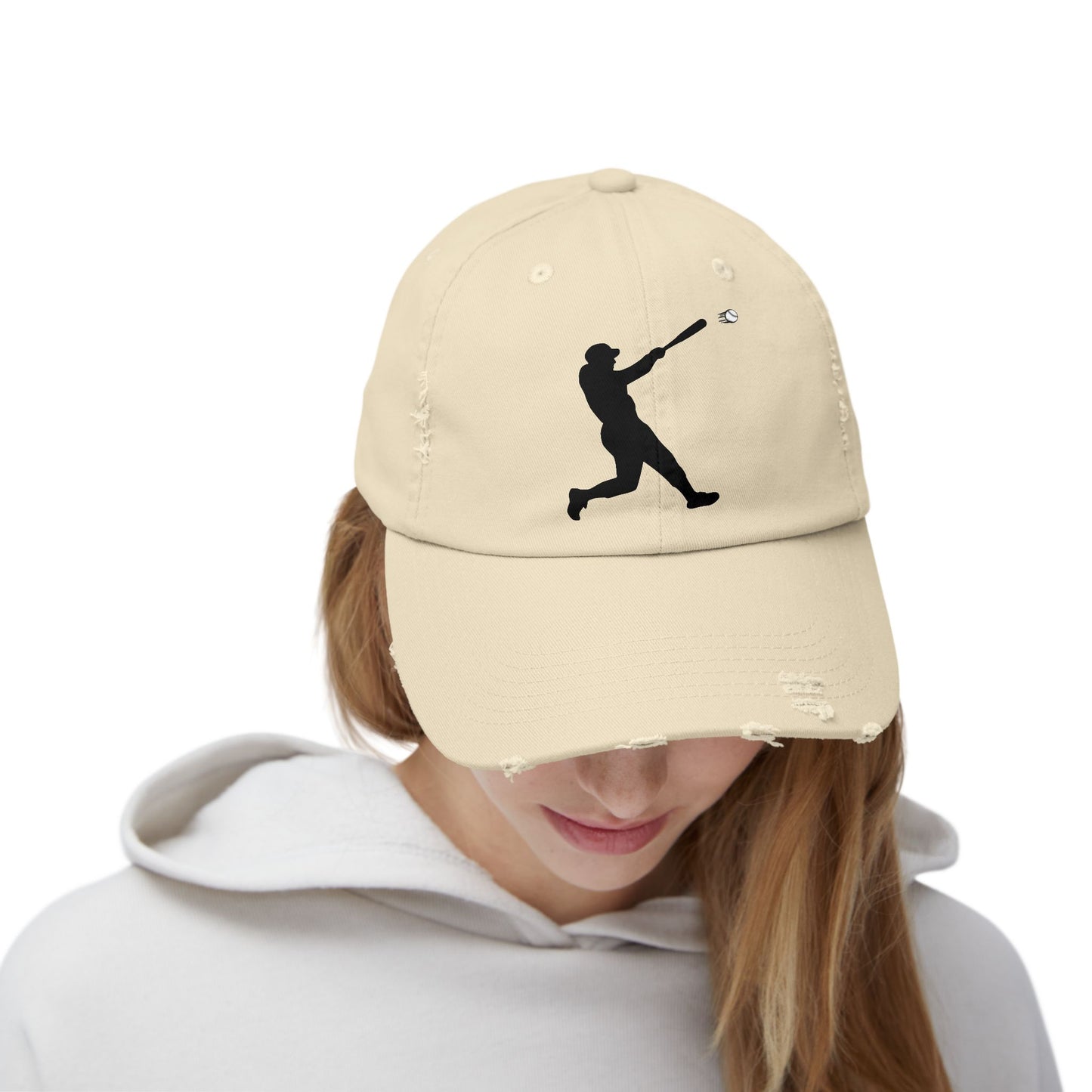 Distressed baseball cap with silhouette batter design, casual hat in neutral tones, featuring a worn, vintage look.