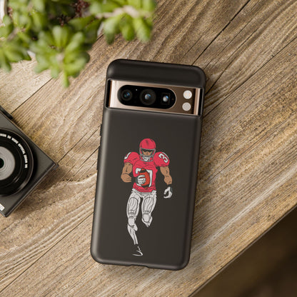 Black football player tough phone case for iPhone, featuring sports design and protective durability by Printify.
