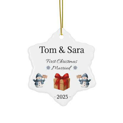 Personalized ceramic ornament with "Tom & Sara First Christmas Married 2025" text, featuring festive holiday design.