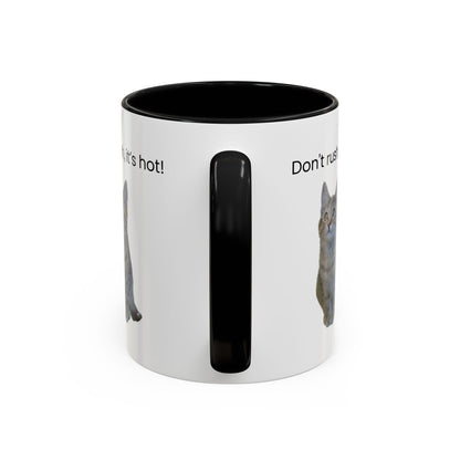 Ceramic cat-themed coffee mug with "Don't rush, it's hot!" slogan, 11 oz, white with black handle and interior.