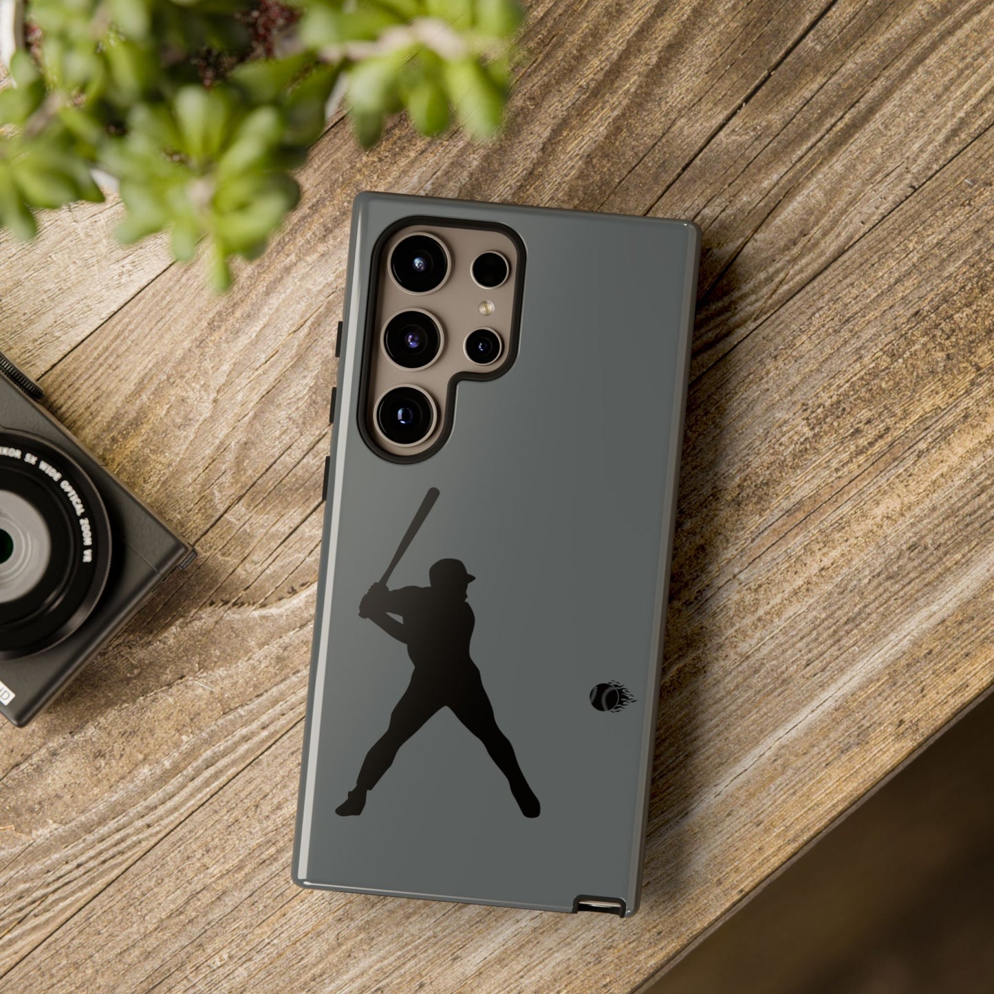 Black tough phone case with baseball silhouette design for iPhone, providing sporty protection and a sleek look.