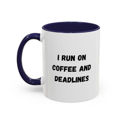 White ceramic coffee mug with "I Run on Coffee and Deadlines" printed in black text, featuring a comfortable handle.