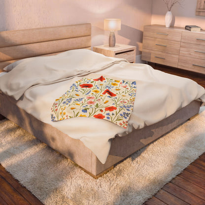 Velvet plush blanket with wildflower meadow and poppy daisy floral print, all-over floral design on soft velveteen fabric.