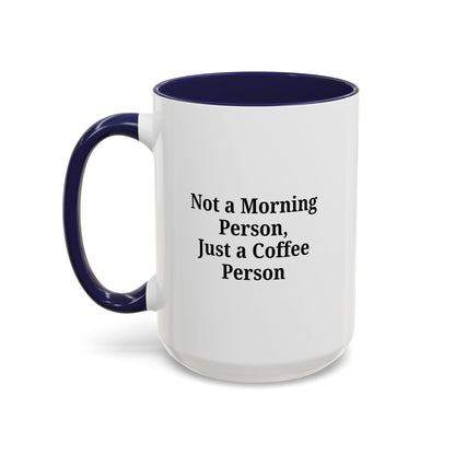 Ceramic coffee mug with the phrase "Not a Morning Person, Just a Coffee Person" in black text on white background.