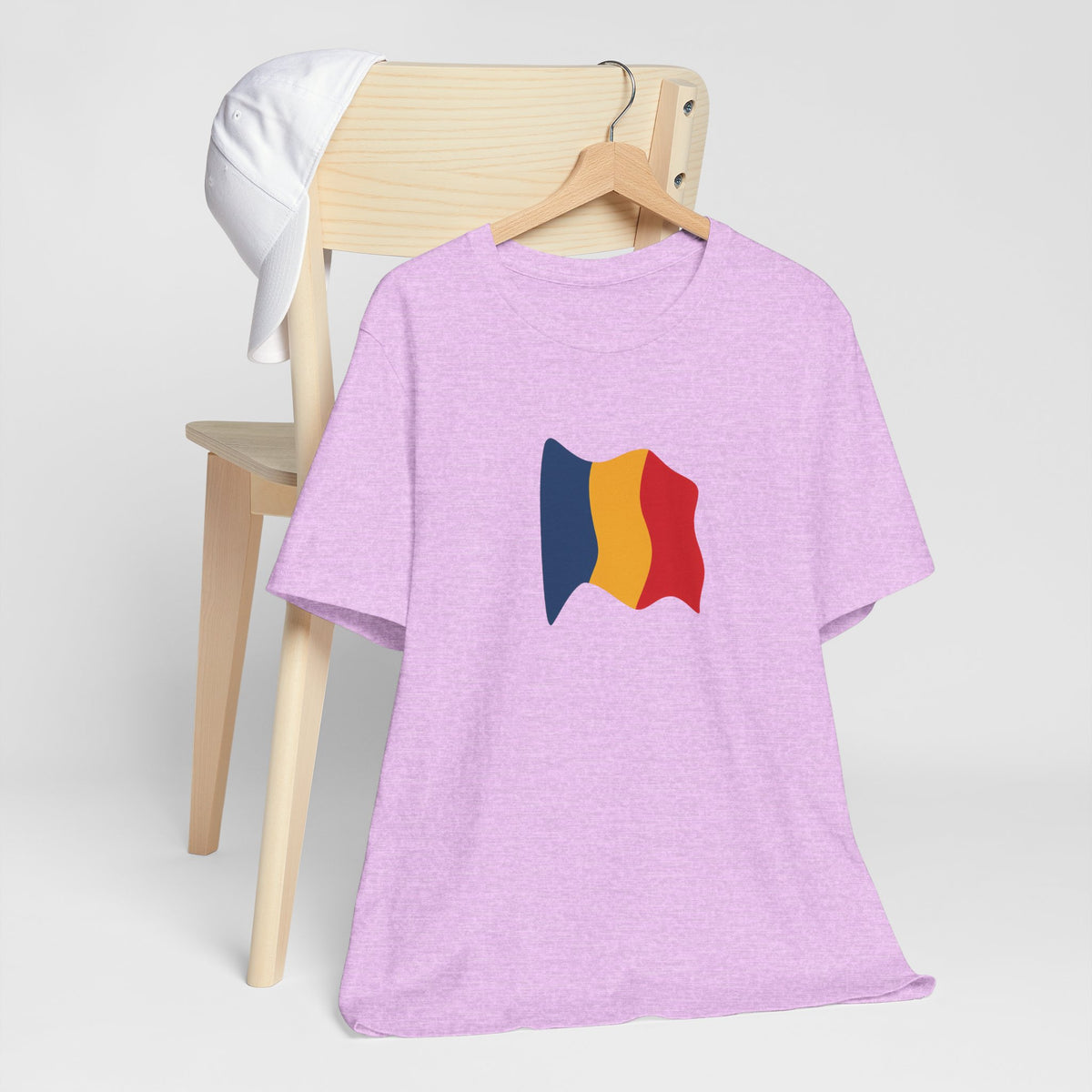 Romania flag T-shirt by Printify featuring a minimal waving tricolor design on a casual men's T-shirt.