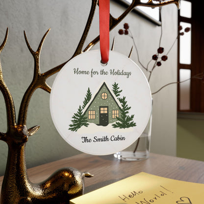 Acrylic "Home for the Holidays" cabin ornament with festive winter scene, designed by Printify for holiday decoration.