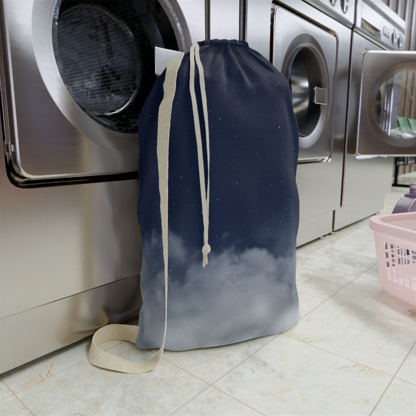 Canvas laundry bag with night sky clouds print and drawstring closure, ideal for laundry organization and storage.
