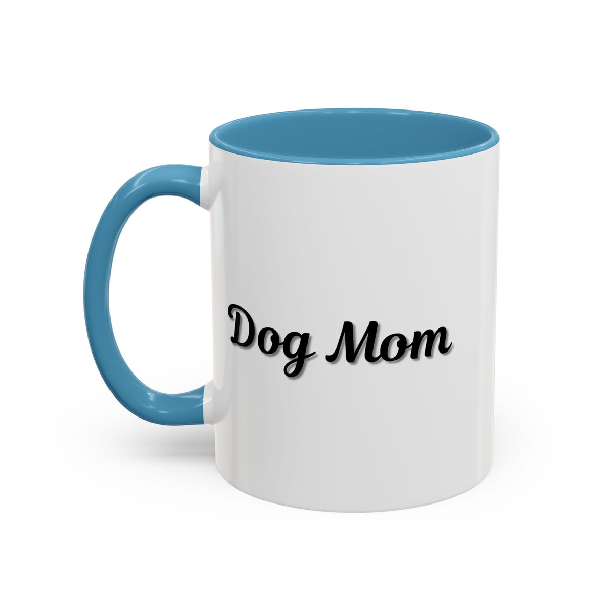 Dog Mom Accent Coffee Mug — white ceramic coffee mug with retro script "Dog Mom" print, colored interior and C-handle, 11oz/15oz, angled view on wooden table