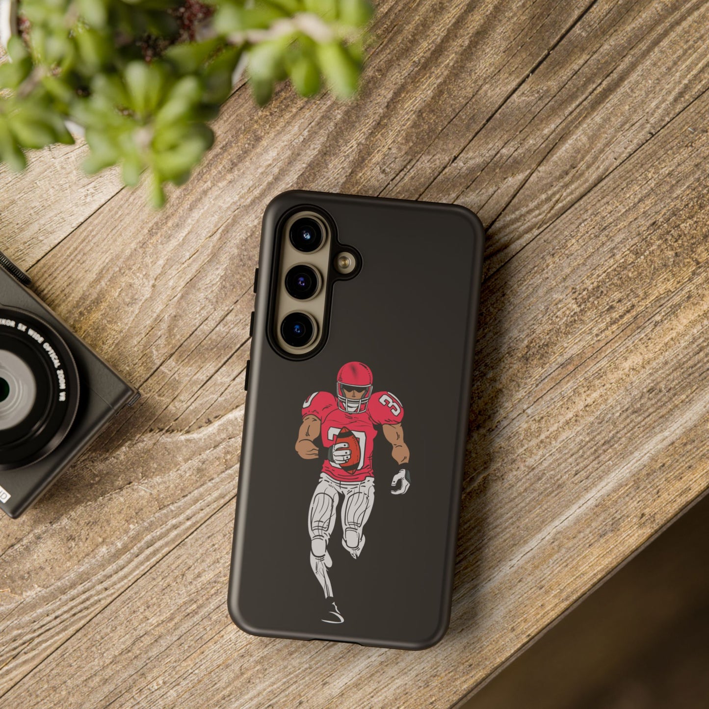 Black football player tough phone case for iPhone with sports design, protective Printify phone case for sports enthusiasts.