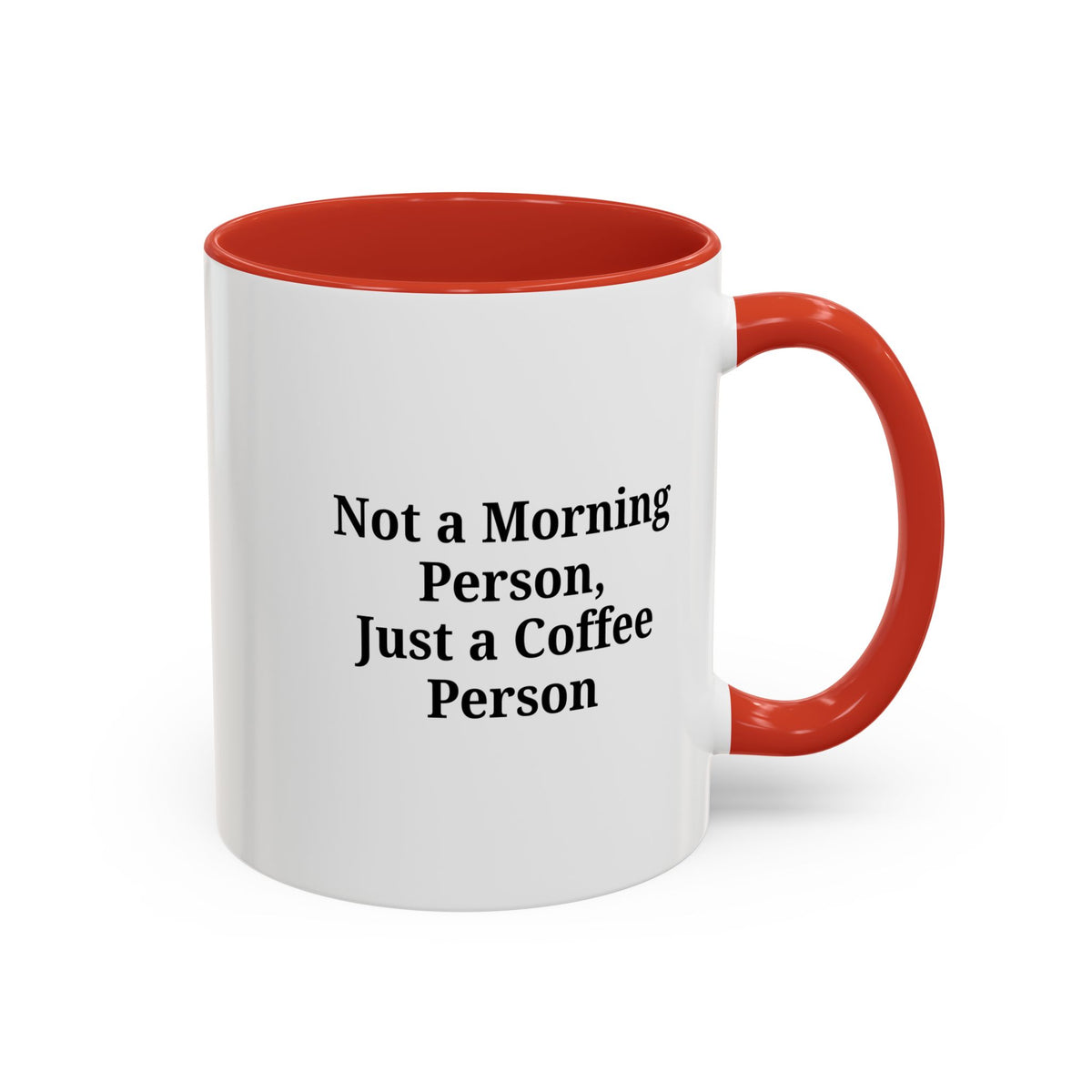 Ceramic coffee mug with "Not a Morning Person, Just a Coffee Person" text, featuring a white design and a sturdy handle.