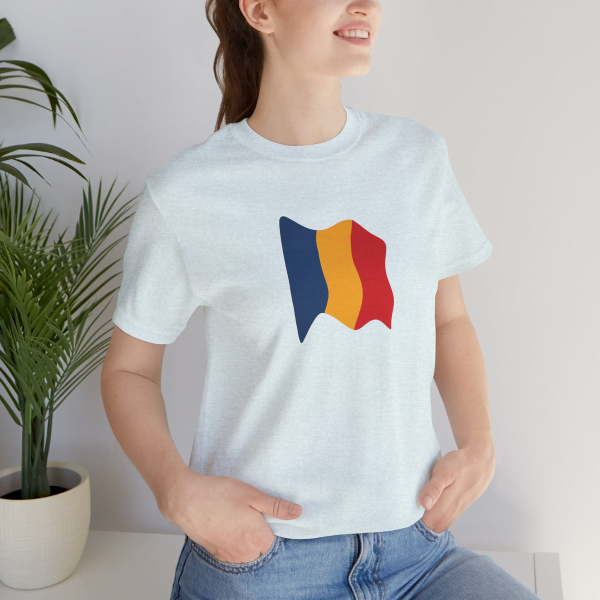 Romania flag T-shirt by Printify featuring a minimal waving tricolor design on a casual tee.