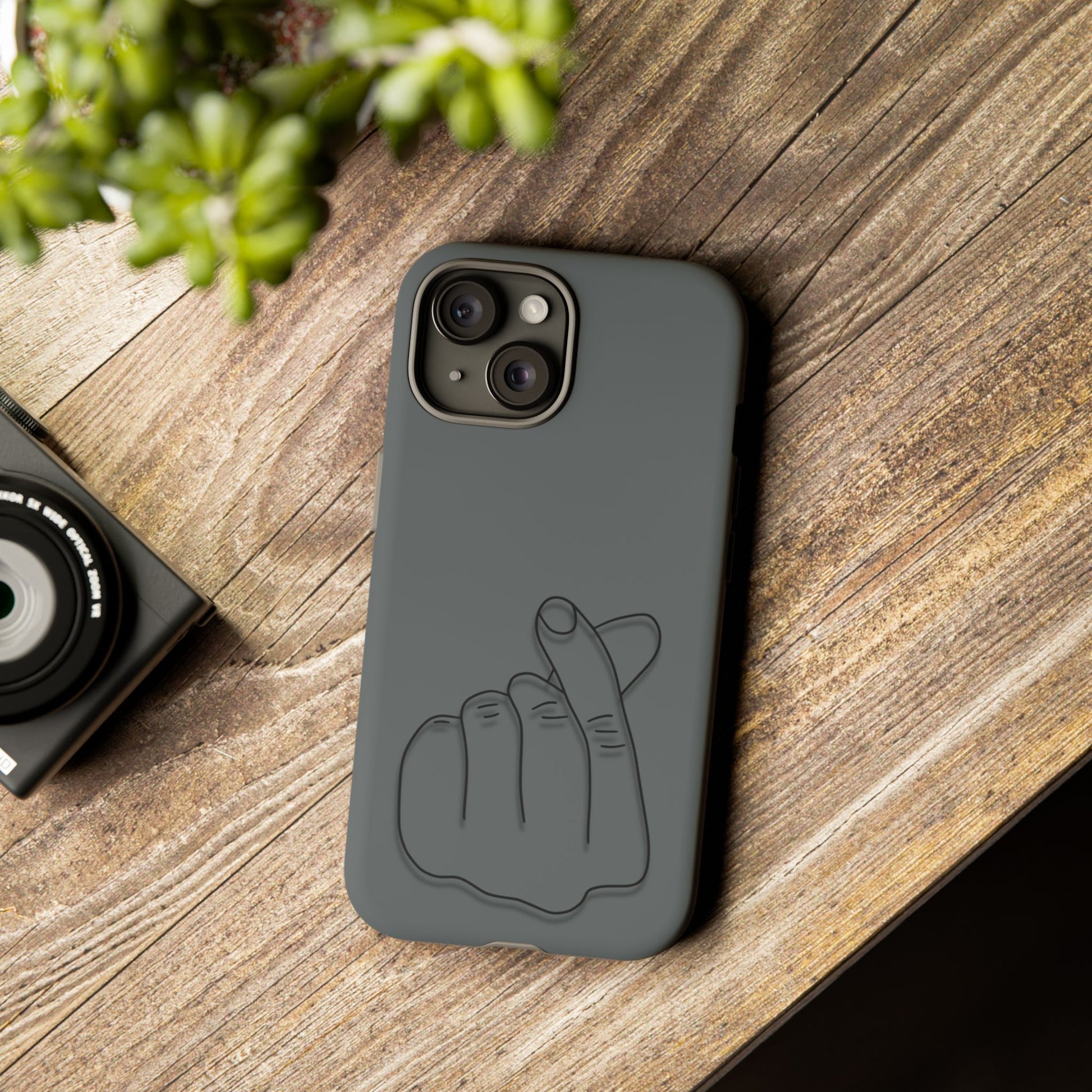 Silicone phone case with embossed Korean finger heart design, compatible with smartphones, by Printify.