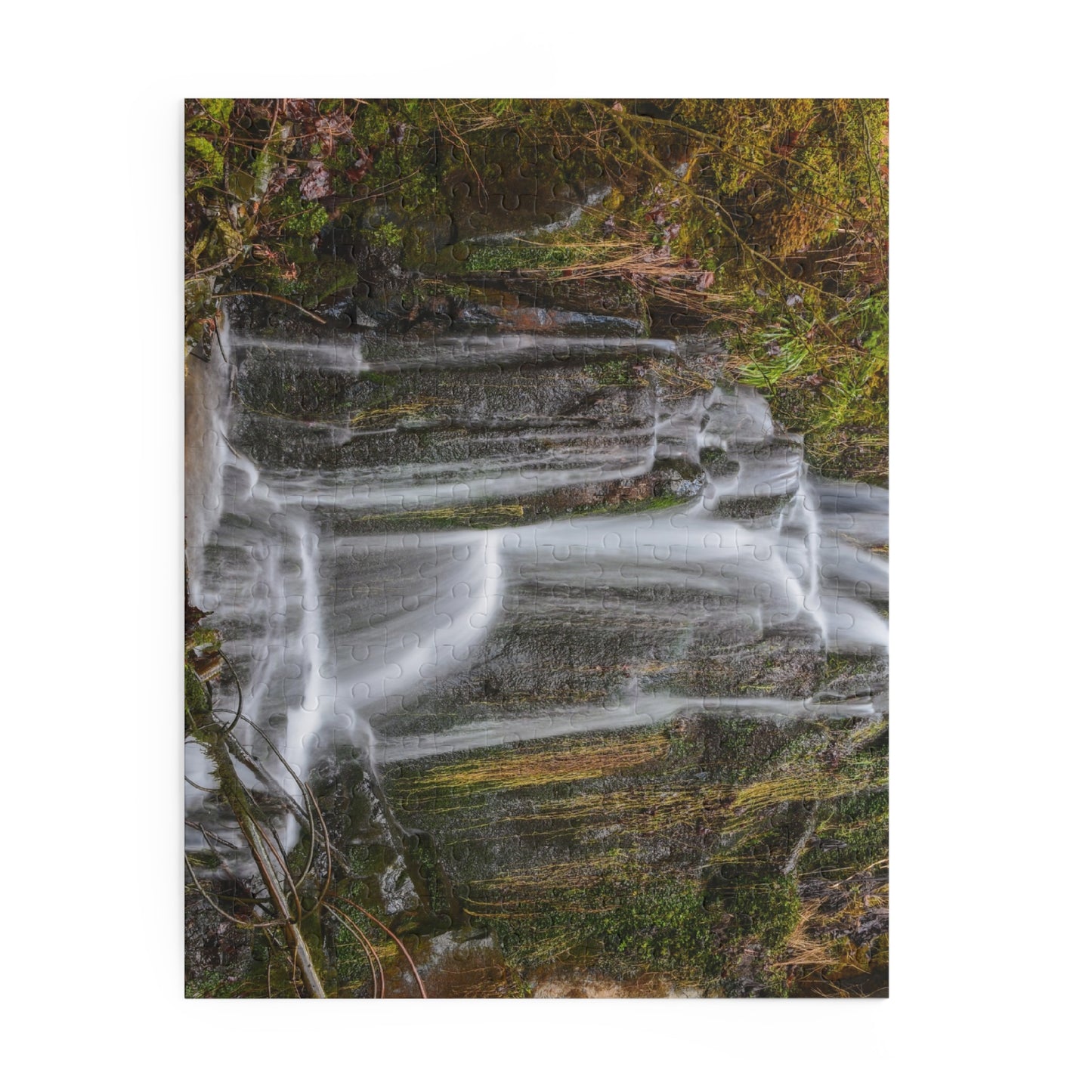 Mossy Waterfall puzzle by Printify showing a scenic nature image with lush greenery and flowing waterfall pieces.