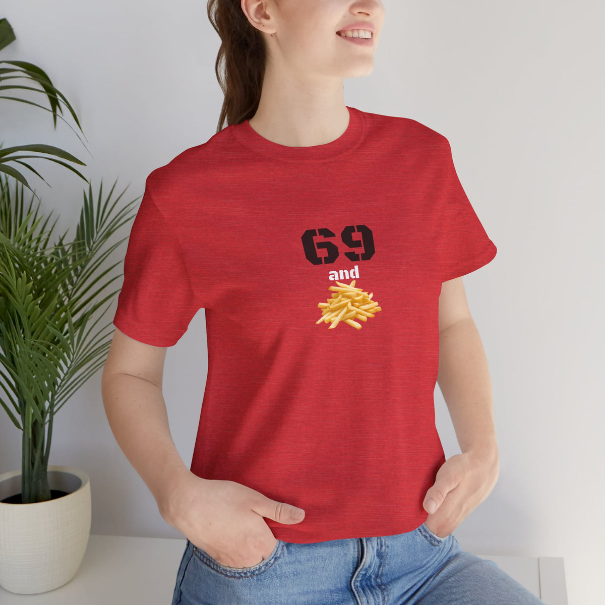 Unisex graphic T-shirt with funny 69 and French fries print, featuring quirky design on a casual cotton tee.